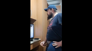 bearded lover jerks off in front of the tv while watching porn