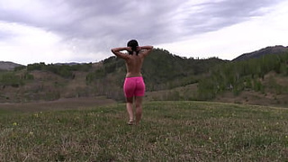 Ravishing booty running outdoors. MILF undresses in nature. PAWG.