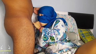 Arab woman in hijab licks her perverted neighbor's african schlong after he shows it to her.