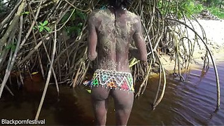 Petite tribe slut with a body full of mud naked outdoor